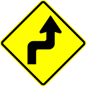 Double sharp curve ahead sign in Panama