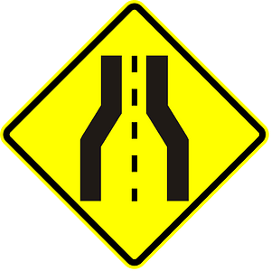 Road narrows ahead sign in Panama