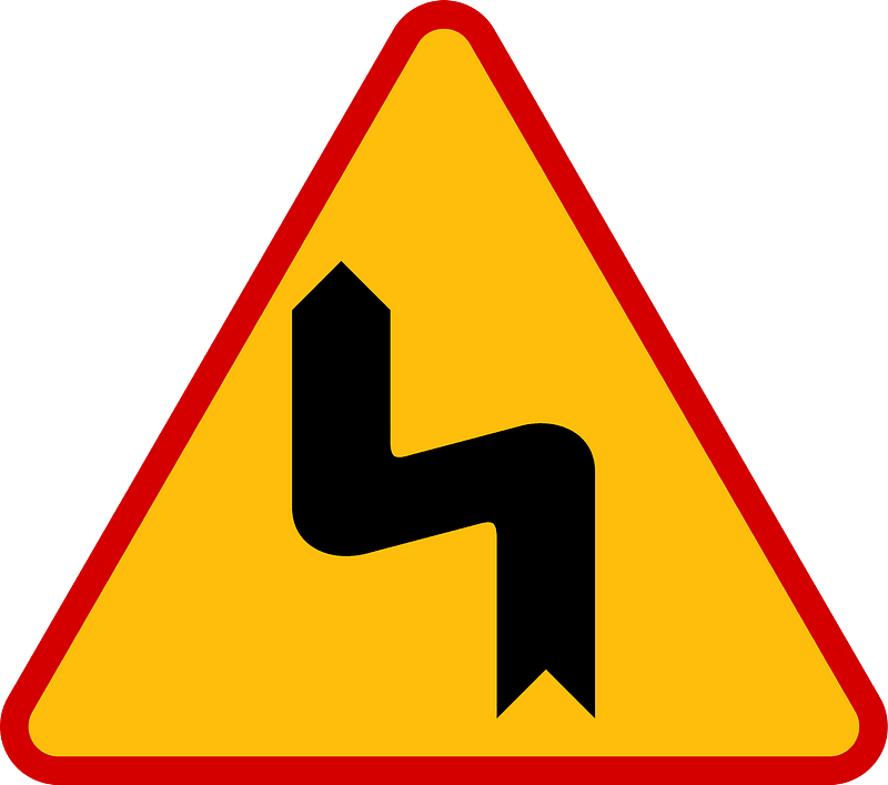 Double bend ahead sign in Poland
