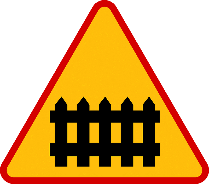 Level crossing with barriers ahead sign in Poland