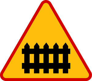 Level crossing with barriers ahead sign in Poland