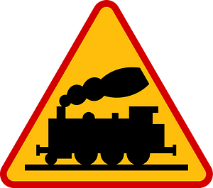 Level crossing without barriers ahead sign in Poland