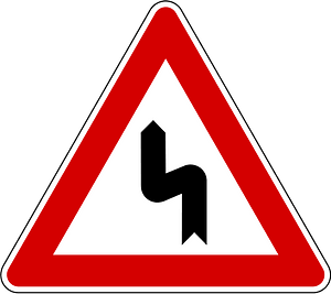Double bend ahead sign in Slovenia