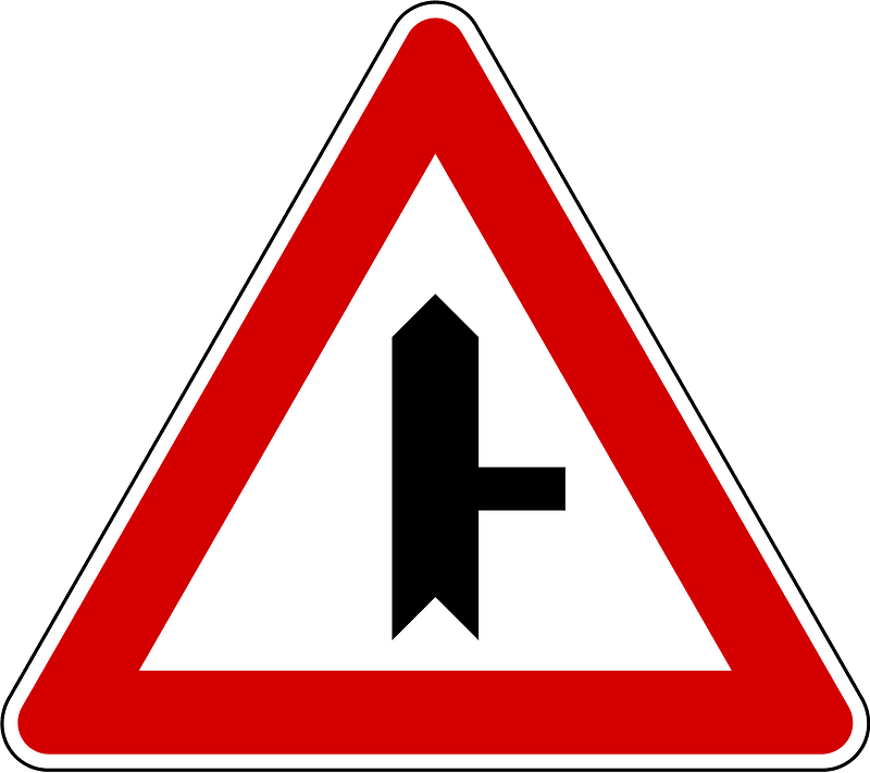 Junction with a minor road sign in Slovenia