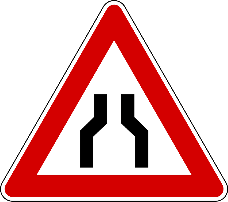 Road narrows on both sides sign in Slovenia