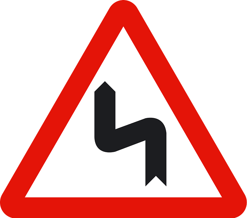 Double bend ahead sign in Spain