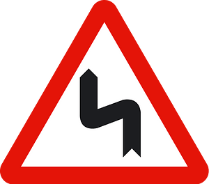 Double bend ahead sign in Spain