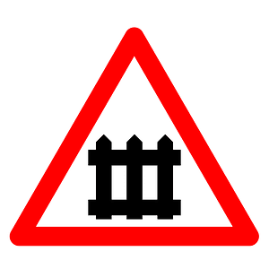 Level crossing with barriers ahead sign in Spain