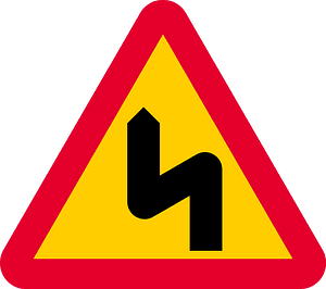 Double bend ahead sign in Sweden
