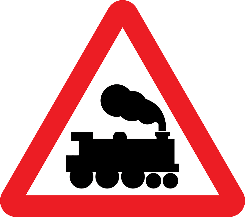 Level crossing without barriers ahead sign in UK