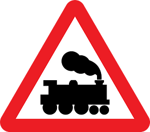 Level crossing without barriers ahead sign in UK