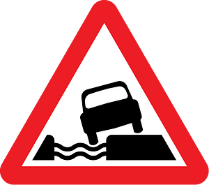 Unprotected quayside or riverbank sign in UK