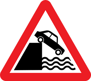 Unprotected quayside or riverbank sign in UK