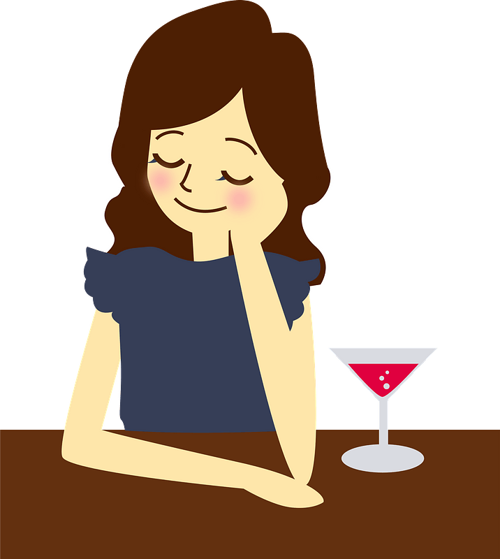 Woman is Having a Cocktail at the Bar