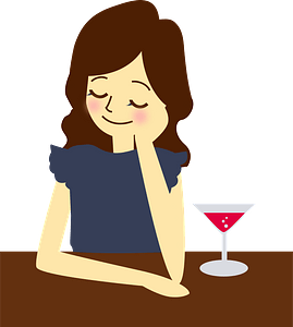 Woman is Having a Cocktail at the Bar