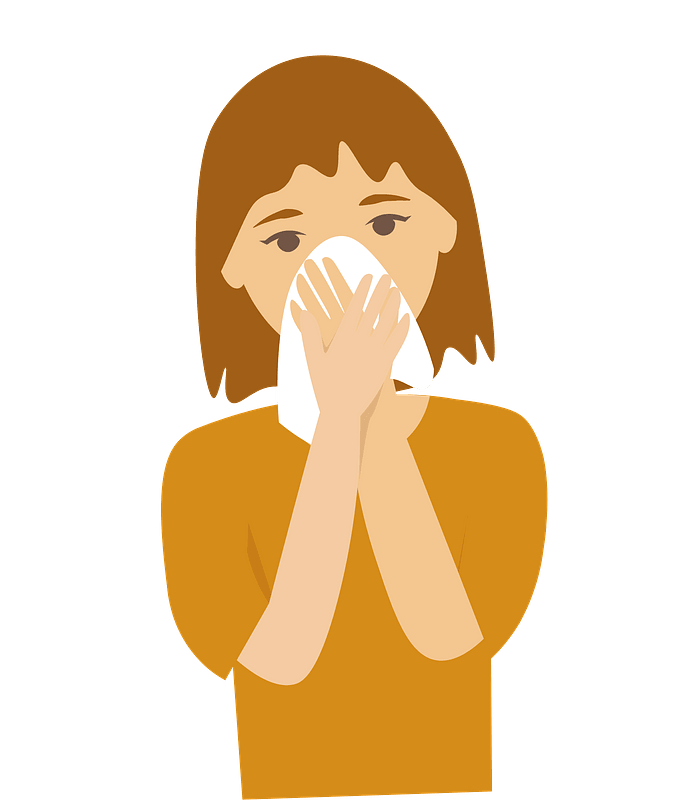 Girl sneezing with tissue