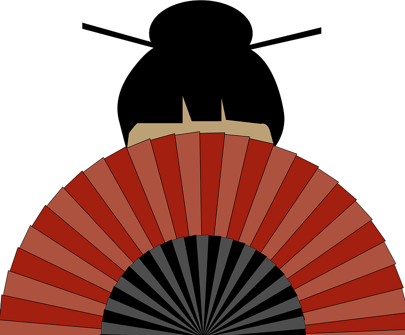 Geisha hiding behind a fan