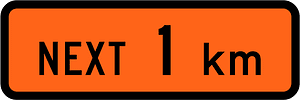 New Zealand road sign W1-1.1A (1 km)