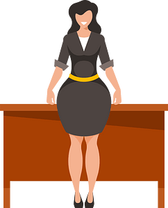 Businesswoman standing by the table