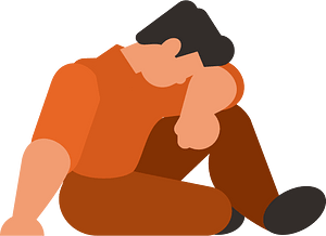 Sad man sitting on the floor