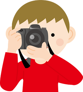 Young Boy Takes a Photo on Camera