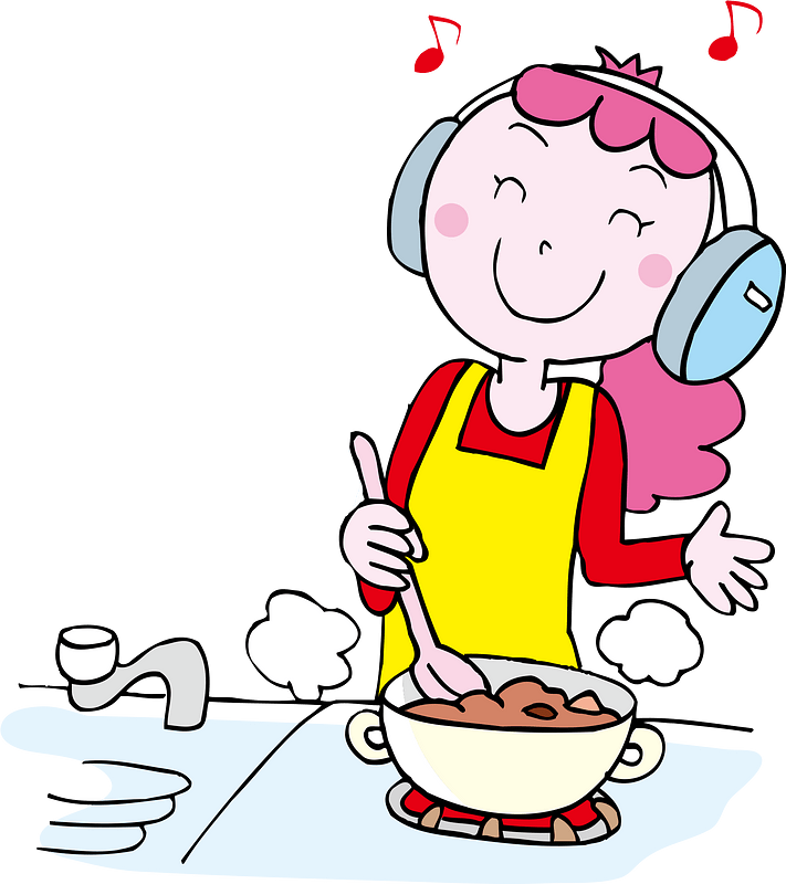 Woman is Listening to Music While Cooking