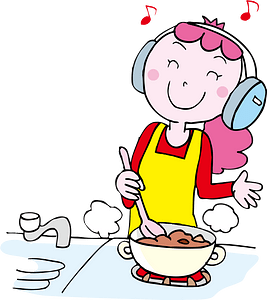 Woman is Listening to Music While Cooking
