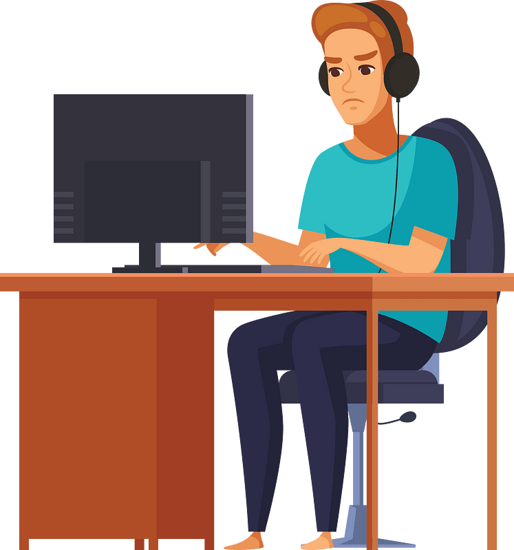 Young Man Sitting At Computer Desk