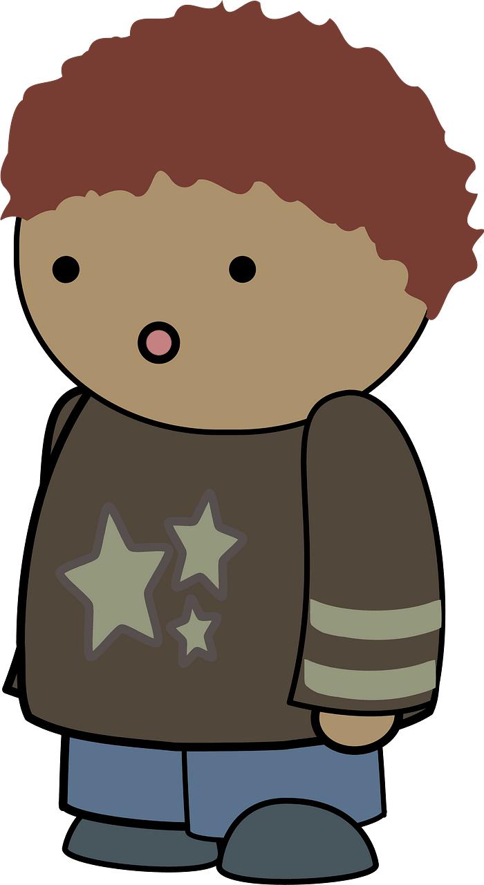 Curly haired boy in a gray shirt, surprised face