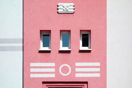 Pastel Pink Building with Small Windows photo