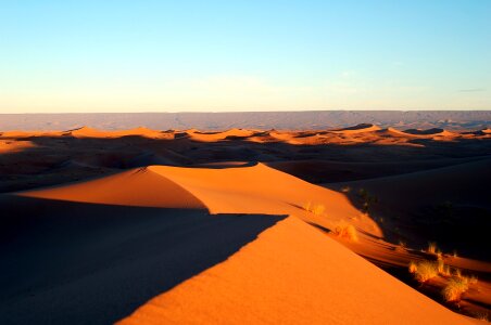 Moroccan desert dune background. Blue sky