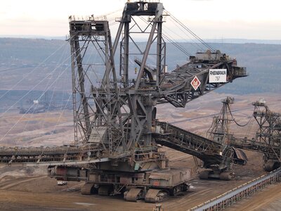 Bucket- wheel excavator closeup in the open-pit mine photo