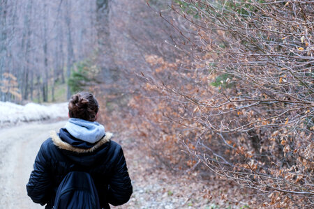 Girl Walking in the Forest on a Cold Weather photo