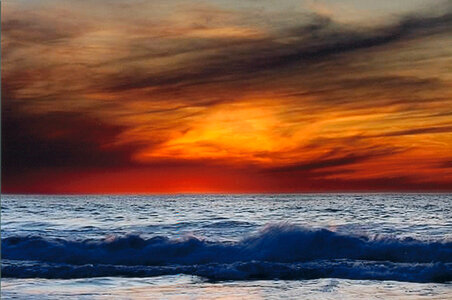 Sunset over the waves of the pacific ocean