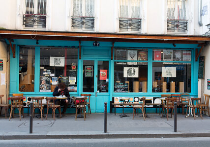 Sidewalk Terrace of a Blue Facade Cafe photo