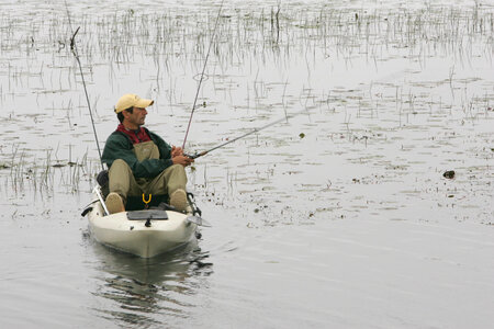 Lone fisherman at Lacassine National Wildlife Refuge photo