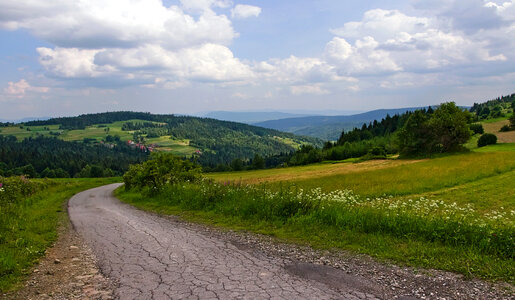 Mountains, sky, road, and clouds in Poland photo