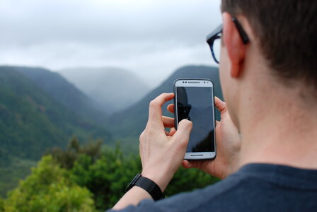 A Man Holding his Smartphone photo