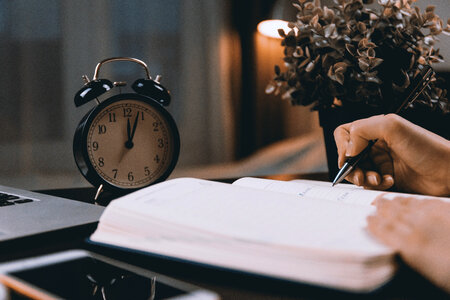 1 Work desk with a retro clock. After midnight. photo