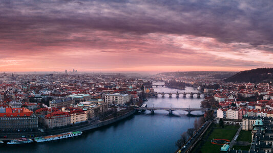 Beautiful Cityscape with a river under dusk skies in Prague, Czech Republic photo