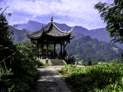 Guangfu pavilion, with summit visible in background in Mount Emei, Sichuan, China photo