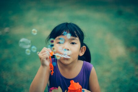 Girl Blowing Bubbles photo