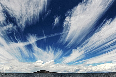 Clouds and Sky with an Island in lake Titicaca in Peru photo