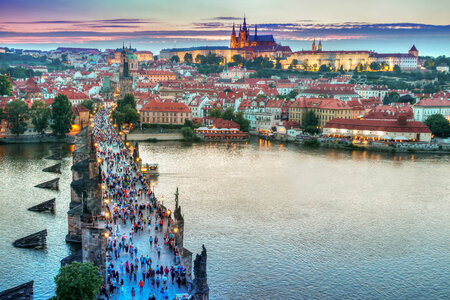 People on the bridge with cityscape in Prague, Czech Republic photo