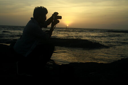 Photographer Shooting Sunset Sea photo