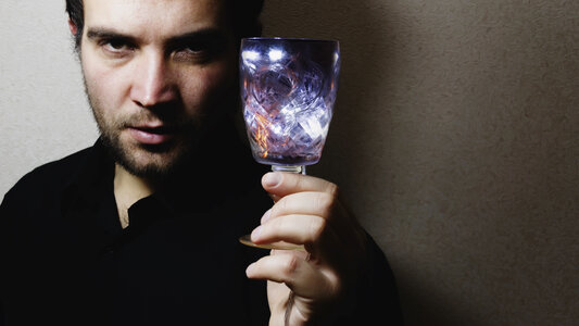man holding wine glass photo