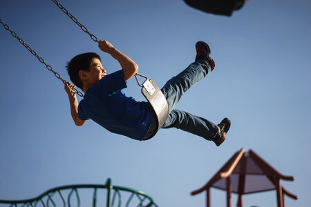 Boy Having Fun on a Swing photo