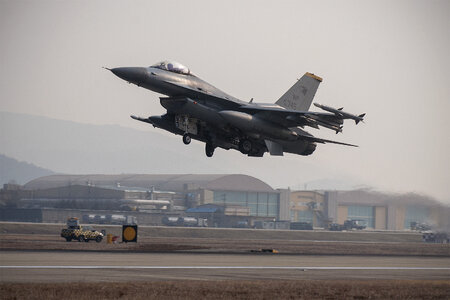 An F-16 Fighting Falcon takes off photo