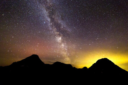 Milky way above the mountains at Glacier National Park, Montana photo