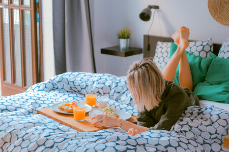 Woman Having Breakfast in Bed photo